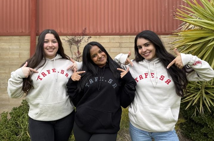 Image of 3 people wearing TAFE SA hoodies