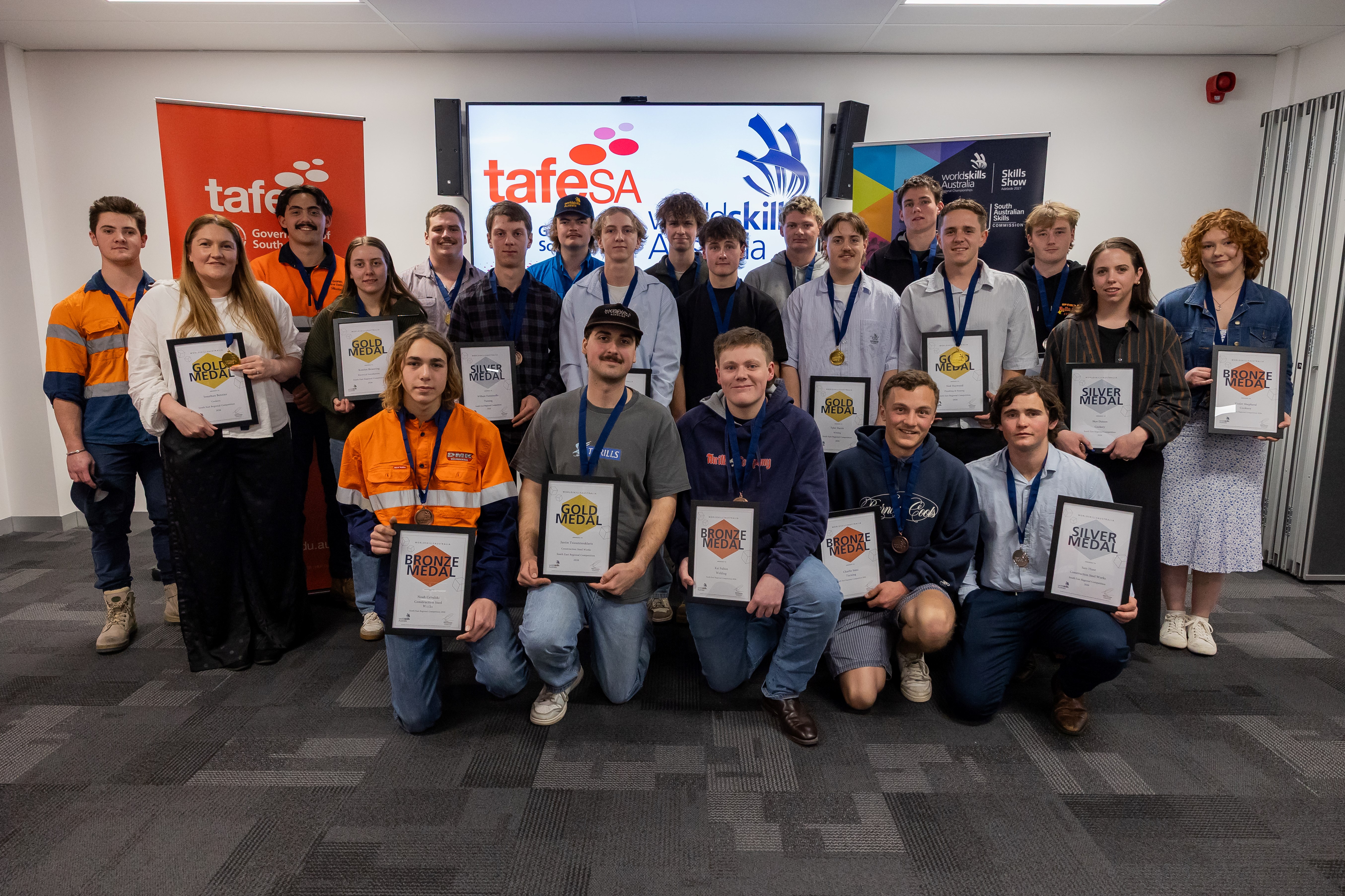 TAFE SA WorldSkills medallists holding their certificates