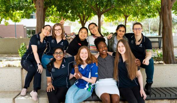 Group of USASA club members posing in front of UniSA building